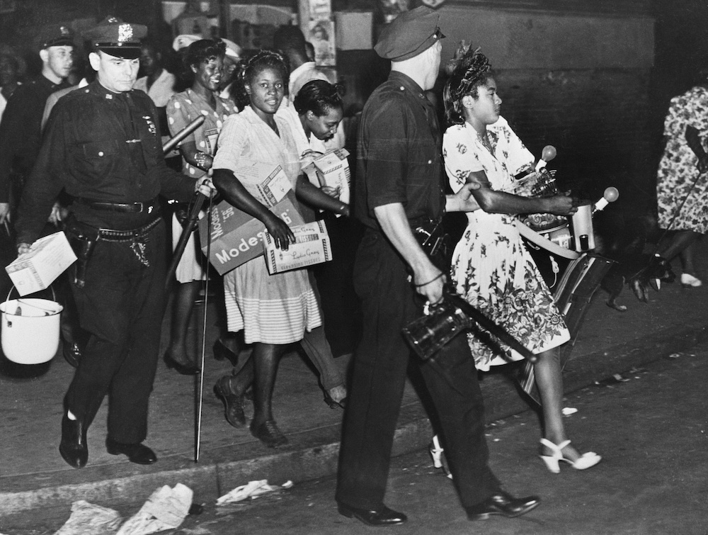 Black women are arrested on suspicion of looting in Harlem in 1943
